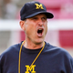 Illustration for article titled Wild-Eyed Jim Harbaugh Informs Players They Must Kill Their Pregame Meal